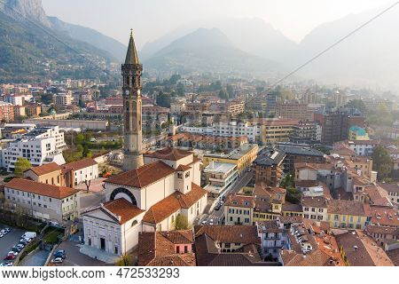 Foggy Aerial Sunrise Cityscape Of Lecco Town On Spring Day. Picturesque Waterfront Of Lecco Town Loc