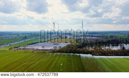 View From Above On The German Motorway A7 With Some Windmills For Renewable Electricity Under Constr