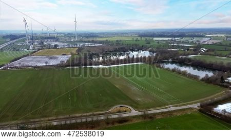 View From Above On The German Motorway A7 With Some Windmills For Renewable Electricity Under Constr
