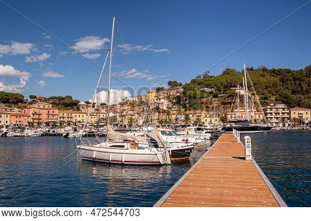 Porto Azzurro Island Of Elba Italy - 19 September 2021 Cityscape Of Harbor Of Porto Azzurro