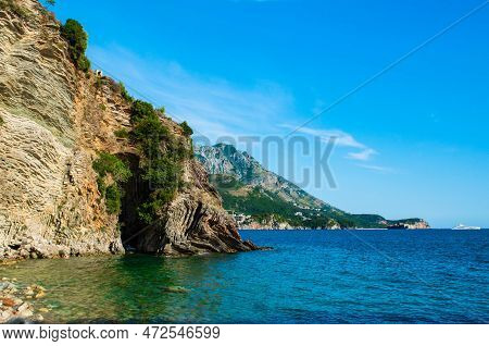 Beautiful Rocks On Pebble Public Stone Beach. Rafailovici Esort Towns. Mountenegro. Adriatic Sea.