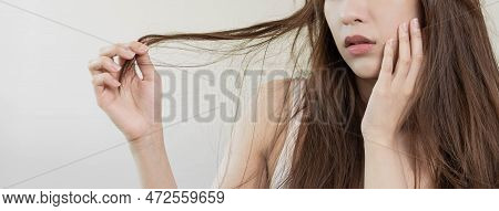 Damaged Hair, Frustrated Asian Young Woman, Girl Hand In Holding Splitting Ends, Messy Unbrushed Dry