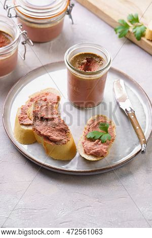 Homemade Chicken Liver Pate On Fresh French White Wheat Baguette Slices On Ceramic Plate, Glass Maso