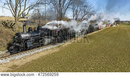 An Aerial View Of A Steam Double Header Freight And Passenger Train, Traveling Thru Farmlands, Blowi