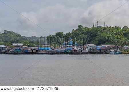 View From The Ferry To Waisai At Sorong With Boats And Houses And A Mosque