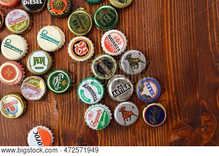 Tyumen, Russia-february 15, 2023: Metal Colorful Collection Of Used Beer Crowns Caps, Top View.