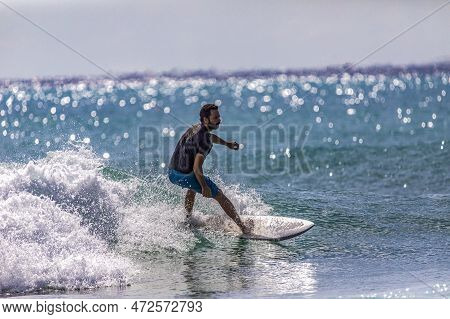 Playa Del Carmen, Mexico; March 13, 2023: A Surfer Enjoying While Balancing His Board On The Crest O