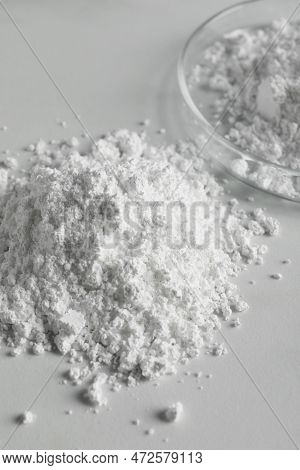 Heap Of Calcium Carbonate Powder On White Table