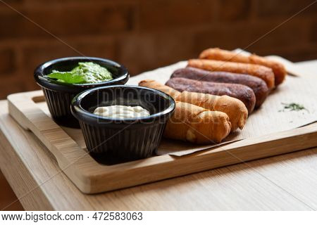 Latin-american Appetizers Called Tequenos Made Of Fried Corn Filled With Cheese