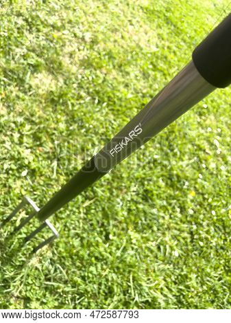 Germany - Apr 13, 2022: View From Above Of A New Fiskars Ground Fork Green Garden Background