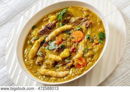 Gungo Peas, Pigeon Peas Soup With Dumplings , Vegetables And Beef In White Bowl On White Table, Jama