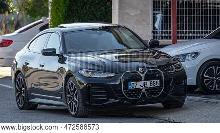 Side; Turkey - February 05 2023:   Black  Bmw 4-series    Is Parked  On The Street On A Warm  Day Ag