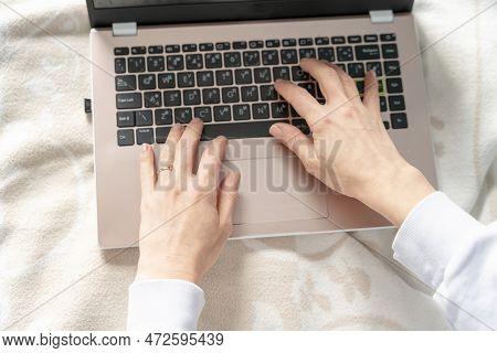 Woman Pointing To The Empty Laptop Screen, Copy Space, Mokup  Of Screen