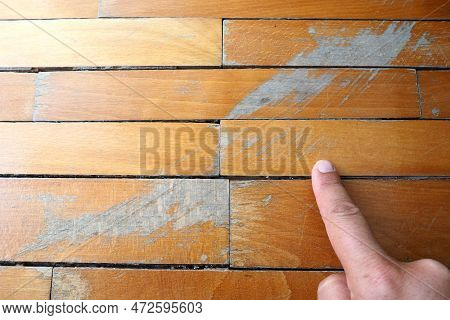 Old, Scratched Parquet Flooring Needs Maintenance. The Parquet Is Damaged By Scratches From Prolonge
