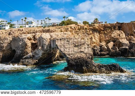 Love Bridge Near Ayia Napa In Cyprus, View From Water. Natural Rock Arch Formation Bridge Of Lovers 