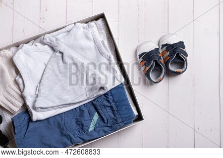 Children's Clothes, Shoes And Toys In Donation Box. Second Hand, Clothing Recycling Concept