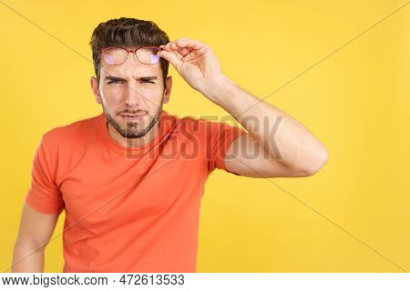 Caucasian Man Taking Off Her Glasses To See