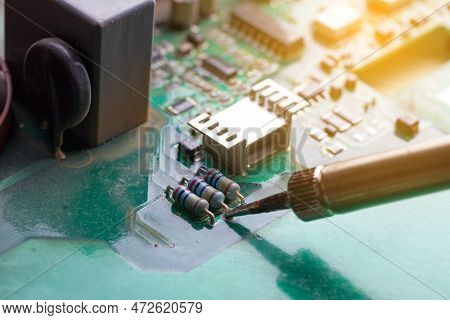 Soldering Iron. Repairing Electronic Component. Microelectronics Engineering Concept