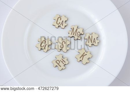 Basic Essential Macronutrients For Humans Written On Wooden Puzzles Lying On A White Plate