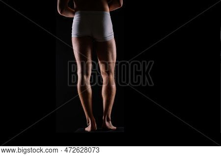Close-up Of Bodybuilders Legs Ready For Competitive Sport White Panties