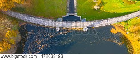 Fojtka Water Reservoir Surrounded By Vibrant Colored Forest At Autumn Time. Aerial View From Drone.