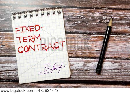 Top View Clock And Miniature People With Text Fixed-term Contract On A White Puzzle Background.