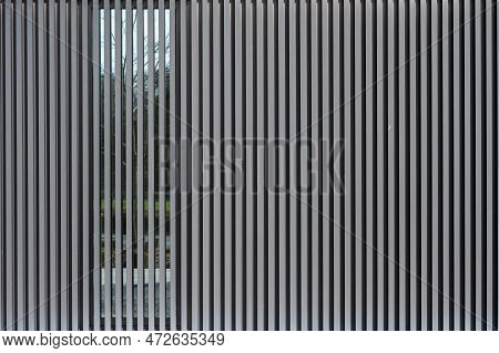 Ternat, Flemish Brabant, Belgium, March 11, 2023 - Vertical Patterned Lines Of A Facade