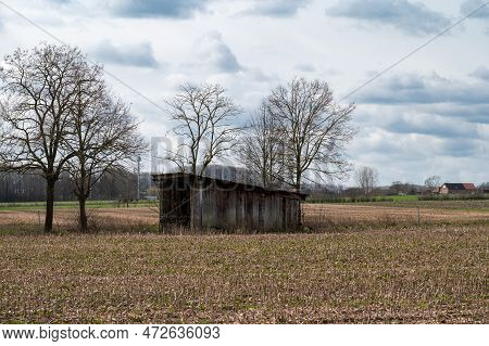 Cropped Fields And A Wooden Shed At The Flemish Countryside Around Ternat, Brabant, Belgium