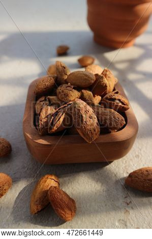 Roasted Almonds In A Brown Wooden Bowl