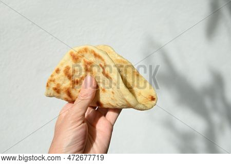 Authentic Sri Lankan Pol Coconut Roti Iin Hand.