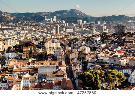 Aerial View Of Marseille City And Mountains In Background, France