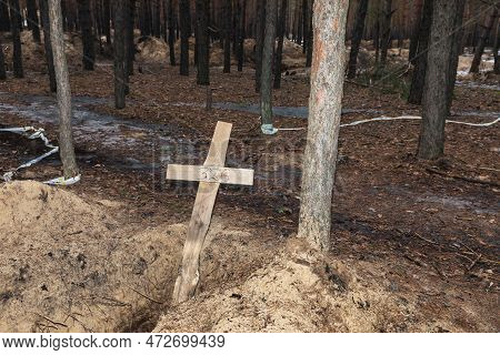Izium, Ukraine - Mar. 03, 2023: Crosses Are Seen At A Forest Grave Site After An Exhumation In The T