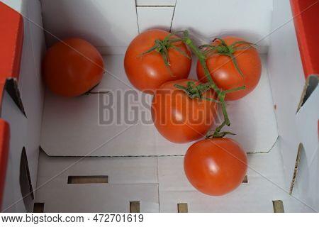 A Few Ripe Red Tomatoes In A Bix