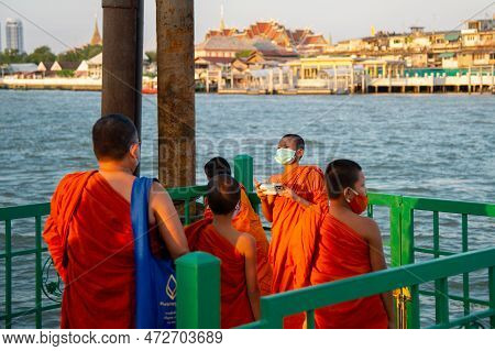 January 3 2023-bangkok Thailand -buddhist Monk Traditionally Dressed In Orange Taking Pictures With 