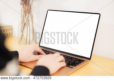 Rear View Of Businesswoman. She Hands Busy Using Computer At Office Or Home Desk, With Copyspace, Bl