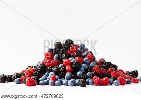 Fresh Organic Berries Close-up Isolated. Colorful Composition Of Blueberries, Raspberries, Blackberr
