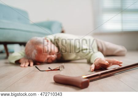 Asian Senior Man Falling On The Ground With Walker In Living Room At Home. Elderly Older Mature Male