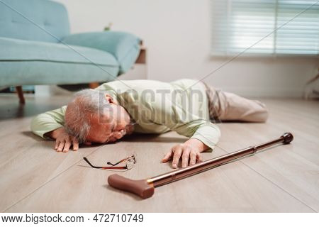 Asian Senior Man Falling On The Ground With Walker In Living Room At Home. Elderly Older Mature Male
