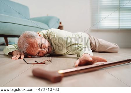 Asian Senior Man Falling On The Ground With Walker In Living Room At Home. Elderly Older Mature Male
