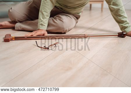 Asian Senior Man Falling On The Ground With Walker In Living Room At Home. Elderly Older Mature Male