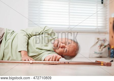 Asian Senior Man Falling On The Ground With Walker In Living Room At Home. Elderly Older Mature Male