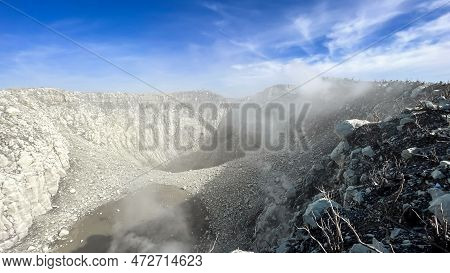 Seeing The Inside Of A Volcano Crater With Smoke In East Java, Indonesia. Aerial View Of Volcano Cra