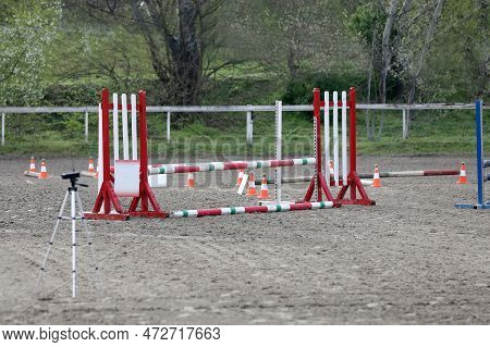 Show Jumping Poles Obstacles, Barriers, Waiting For Riders On Show Jumping Training. Horse Obstacle 