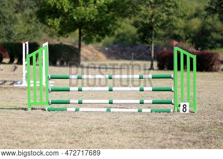 Show Jumping Poles Obstacles, Barriers, Waiting For Riders On Show Jumping Training. Horse Obstacle 