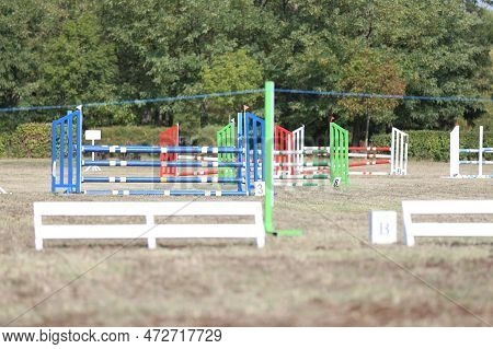 Show Jumping Poles Obstacles, Barriers, Waiting For Riders On Show Jumping Training. Horse Obstacle 