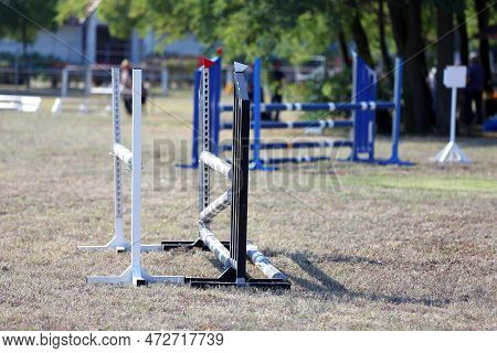 Show Jumping Poles Obstacles, Barriers, Waiting For Riders On Show Jumping Training. Horse Obstacle 