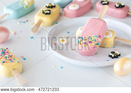 Cakesicles Decorated For Spring And Easter Scattered About With Two On A Plate.