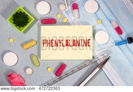 Phenylketonuria Write On A Book Isolated On Wooden Table. Medical Or Healthcare Concept.