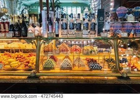 Craft Chocolate Bites, Marzipan Chocolate Candy, Alcohol Drink Bottles A Lot On Shop Window, Store S