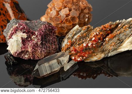 Close Up Photo Of The Group Of Stones And Minerals Including Vanadinite On Barite, Aragonite Sputnik